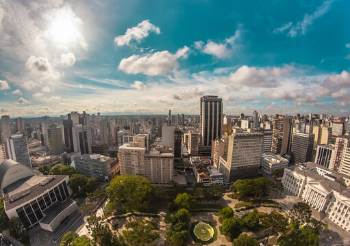 Aerial wide-angle landscape view of urbanized center with colorful skyscrapers in the morning - Santos Andrade Square - Curitiba, capital of Paraná State, Brazil