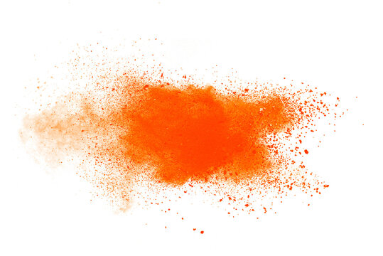 Orange powder explosion isolated on white  background.