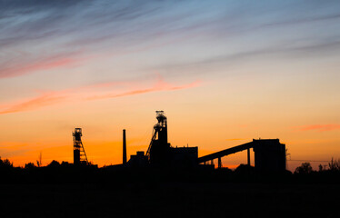 Old mine against the backdrop of a beautiful sunset