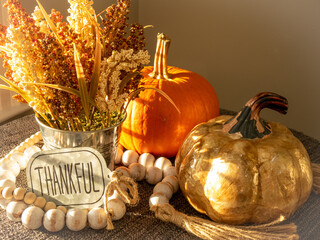 Autumn still life with small thankful sign.