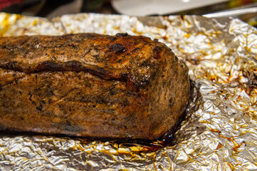 Grilled baked pork meat on foil