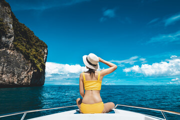 Traveler asian bikini woman relax and travel in boat on sea Phuket Thailand