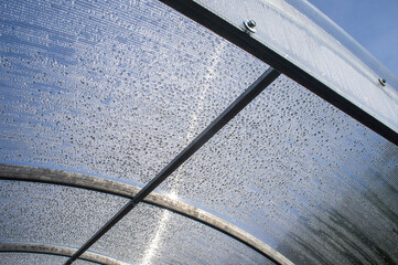 Metal fasteners and ceilings in a polycarbonate greenhouse
