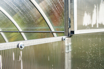 Metal fasteners and ceilings in a polycarbonate greenhouse