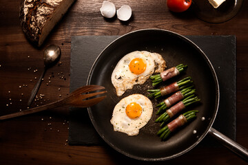 English breakfast.Eggs and bacon, cooking, breakfast preparation
