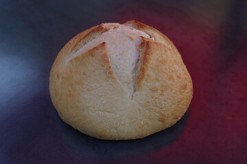 High angle close-up view of a fresh boule of San Francisco style sourdough bread