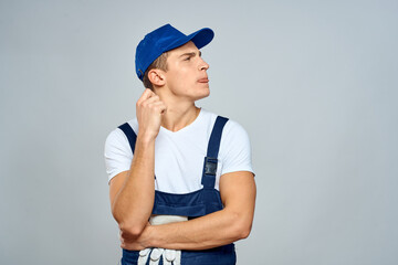 working man in uniform service lifestyle delivery service light background