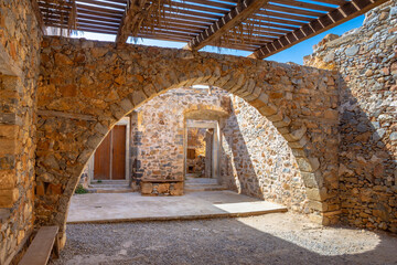 View of the island of Spinalonga with calm sea. Here were isolated lepers, humans with the Hansen's desease, gulf of Elounda, Crete, Greece. 