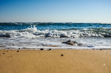 Beautiful landscape, stone, sand and waves on the sea