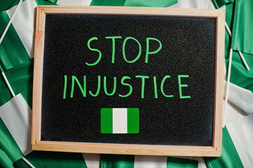 Stop injustice. Inscription of nigerian protest slogan.