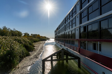 Fototapeta na wymiar River cruise ship in the rays of the summer sun