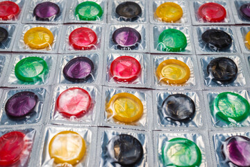 Colorful condoms background.