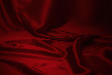 Red silk or satin luxury fabric texture can use as abstract background.