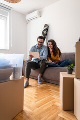 Happy couple choosing new wall color stock photo