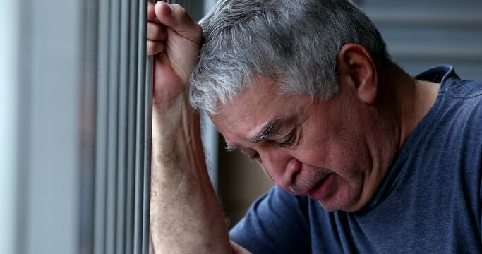 Older man feeling guilt and loneliness, senior retired person crying suffering with sorrow