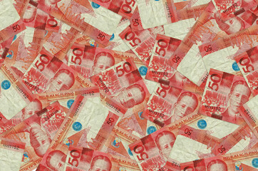 50 Philippine piso bills lies in big pile. Rich life conceptual background