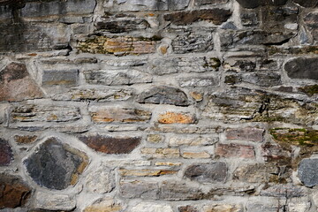 Full frame of an old stone wall built in the 18th century from the historical site of the old...
