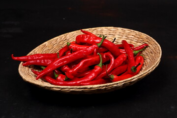 Red hot chili peppers on a black background