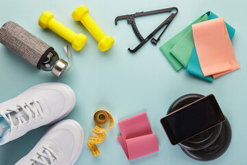 Creative flat lay of sport and fitness equipments.