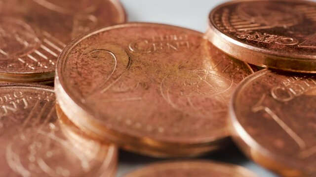 1 and 2 euro cent coins macro view with selective focus. Suitable for the Uniform rounding rules for cash payments and circulation of 1 and 2 cent coins public consultation from european comission.