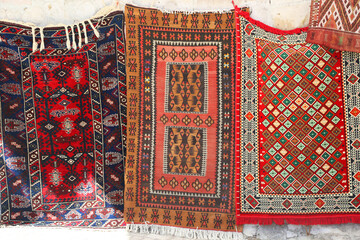 Persian carpet and rugs in Turkey. Oriental moroccan rugs hanging on the market. 