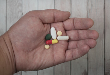 Drug use. Abuse of drugs - concept. Pills held in the palm