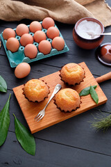 Homemade cupcakes on rustic background
