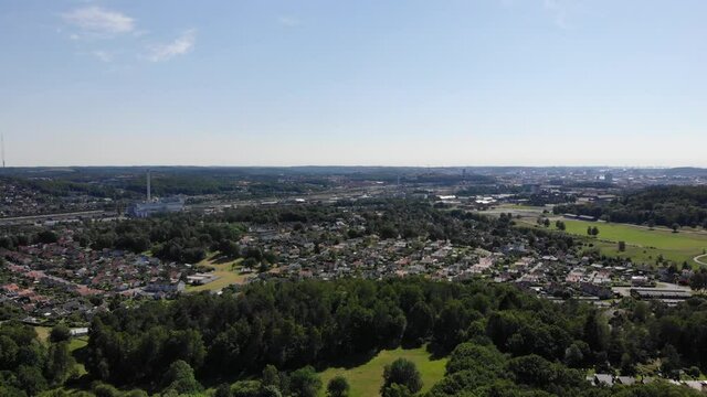 Aerial view of residential area outside Gothenburg surrounded by green trees
