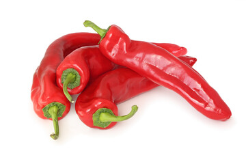 Several red long sweet peppers isolated on white