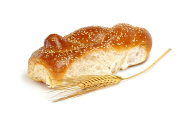 Tasty roll with wheat of spikelets isolated on white