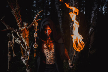 Sorcerer with marks on his body in the forest