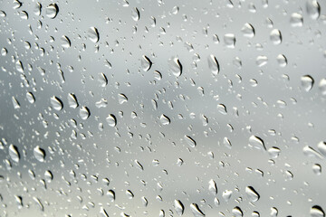 Drops of rain on a window pane in the attic