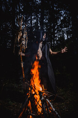 Naklejka premium Sorcerer with marks on his body in the forest