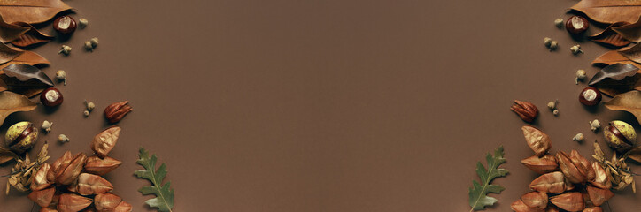 Autumn and fall composition made of dried leaves, chestnuts and acorns.