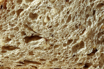 freshly baked rye bread with bran and cereal seeds: texture close-up. Healthy food.