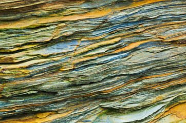 Rock layers - a colorful formations of rocks stacked over the hundreds of years. Interesting background with fascinating texture