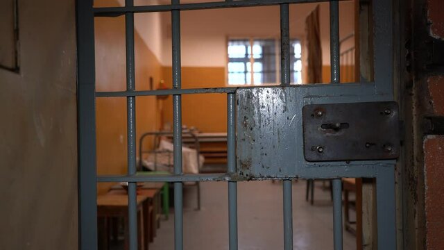 Prison Metal Door Protect Prisoner From Inside to Escape. Food Channel Through Prison Cells Bars. Jail, Detail of Confinement and Crime, Justice. Prison Interior.