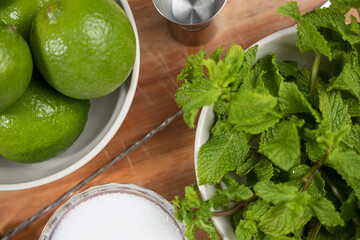 Close-up of mojito cocktail ingredients on wooden cutting board