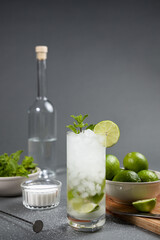Mojito cocktail preparation. Some ingredients and tools on the table