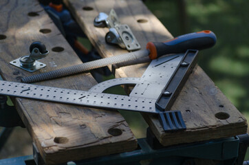 Fototapeta na wymiar Tools of a carpentry workshop to mount a caster wheel