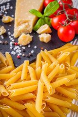 concept of traditional italian pasta with tomatoes and basil