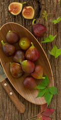 Fresh fig fruits on a wooden background.