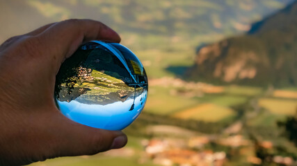 Crystal ball alpine landscape shot at the famous Kanzlerkehre,  Tyrol, Austria