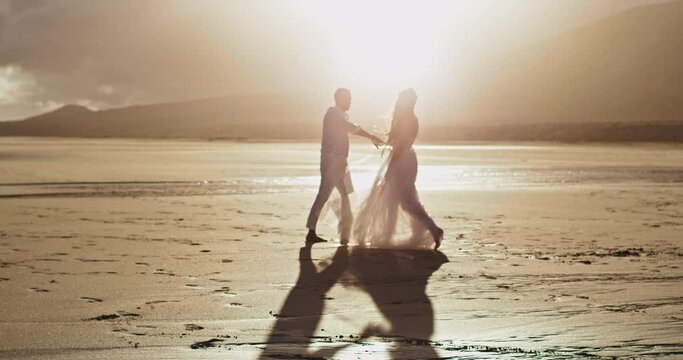 Standing in front of the camera couple on the beach background amazing landscape view of the seaside