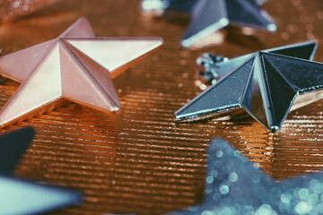 Decorative Christmas stars on golden background