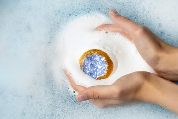 Bath bomb with sea salt crystals on a white background. High quality photo