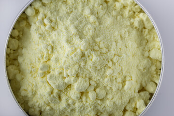 purified sulfur powder on a white acrylic background