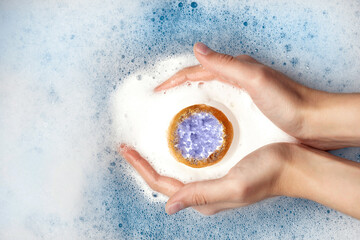Bath bomb with sea salt crystals on a white background. High quality photo
