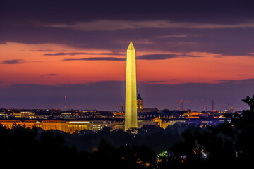 Washington Monument at sunrise with orange and purple clouds in the background Washington DC, USA	