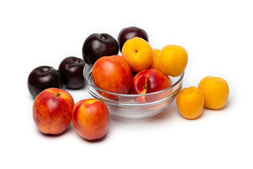 nectarine, peach and plum on a white background